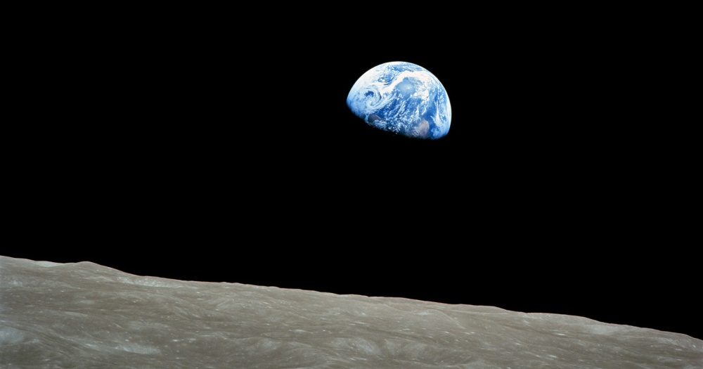 Earth partially in shadow, as seen from the moon. From Apollo 8 space mission.
