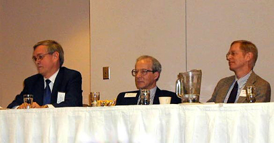 Seppo Kanerva, Ralph Zehr, and Jeffrey Wattles in a panel discussion on outreach.