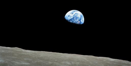 Earth partially in shadow, as seen from the moon. From Apollo 8 space mission.