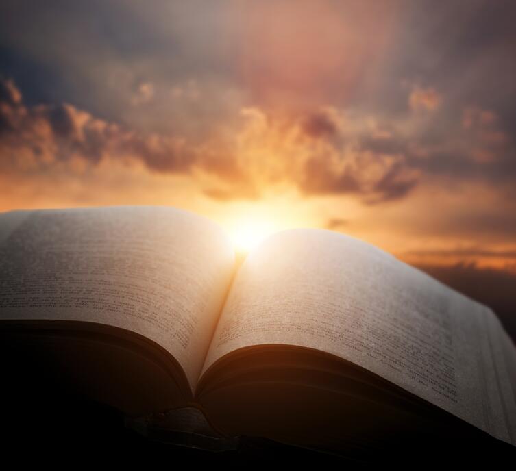 Open book against a sunset